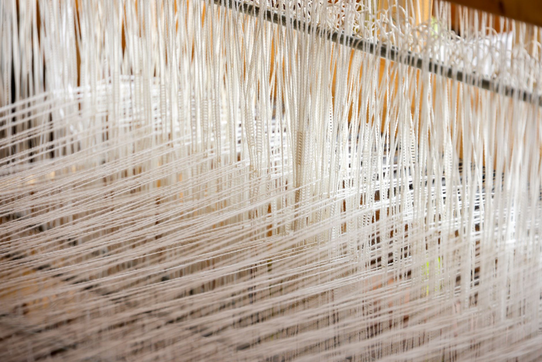 ancient wooden loom iron age textile workshop earth clay weights hanging threads prehistoric spanish weaving