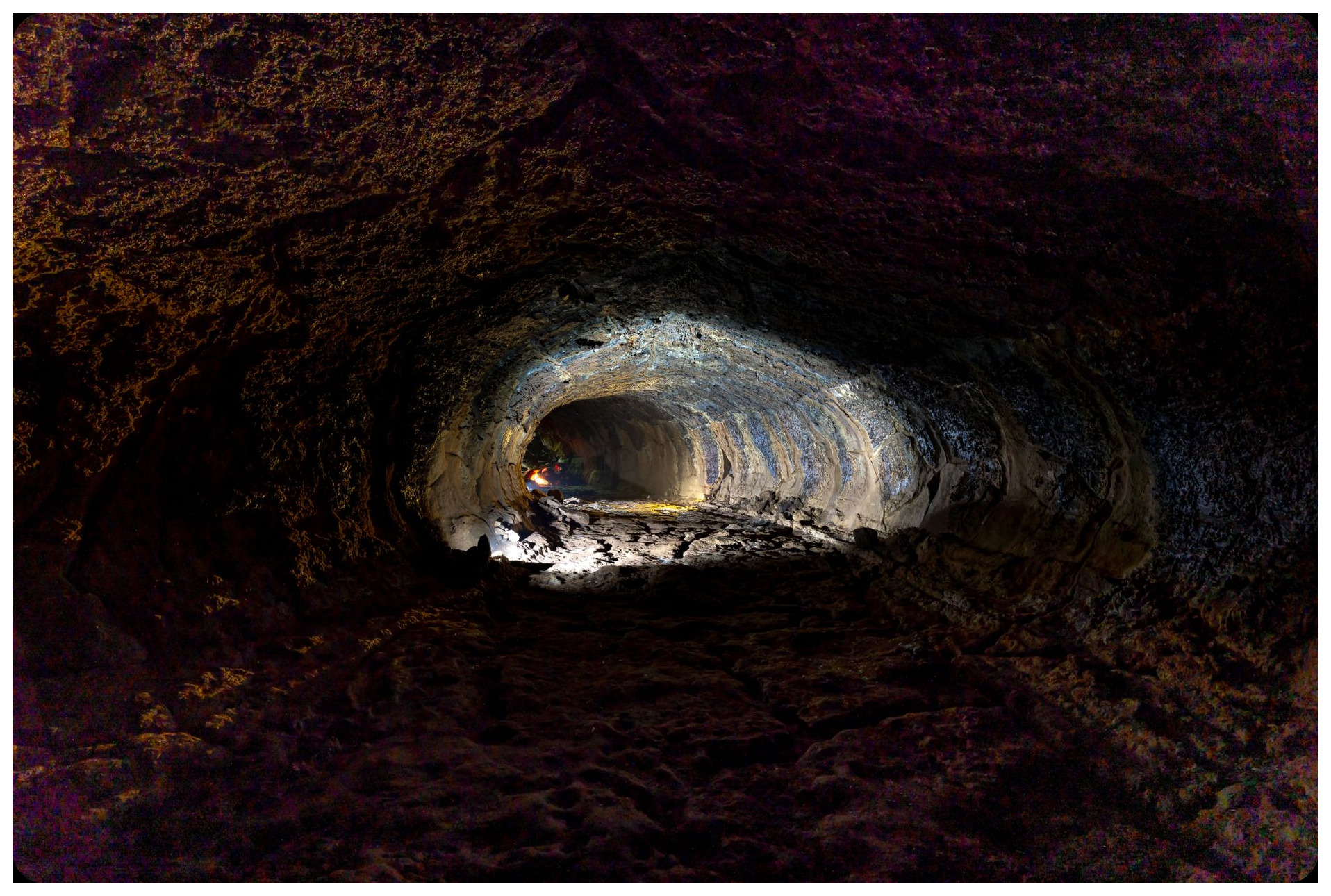 underground Roman aqueduct gallery in Sevilla with flowing water and stone walls, dark subterranean tunnel system