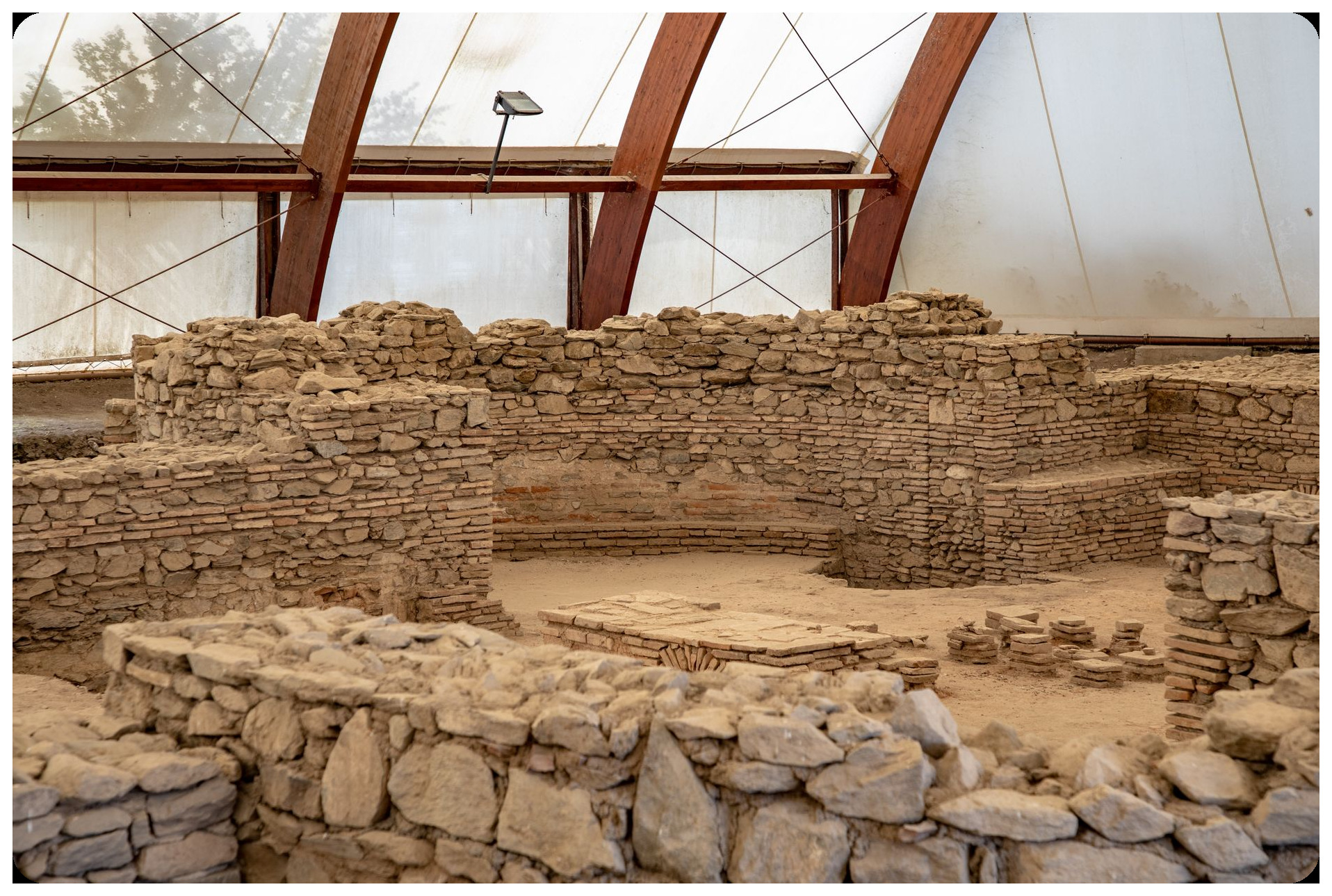 ancient stone tools and hand axes excavated from pleistocene deposits dramatic archaeological site spanish landscape