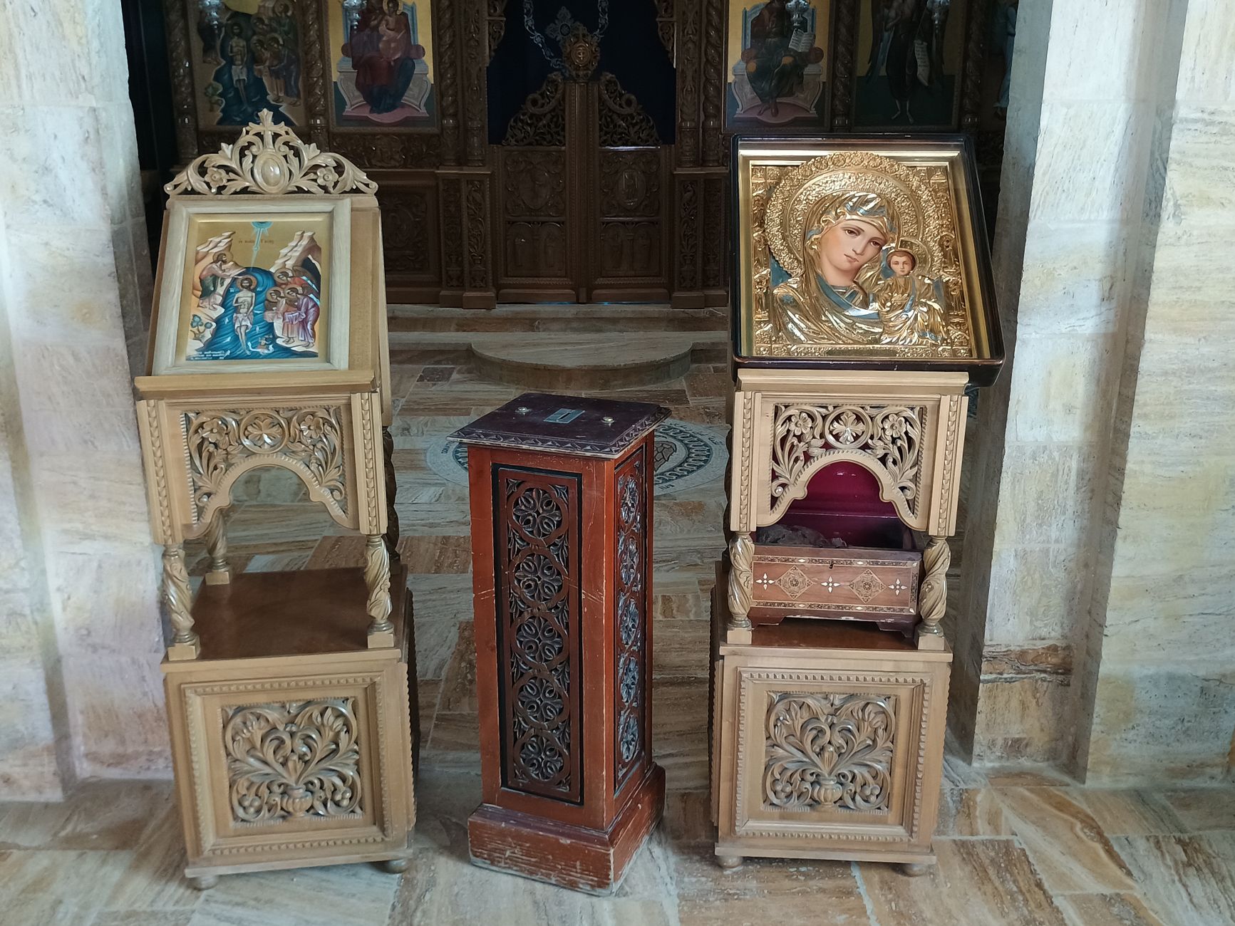baroque wooden retablo altar with carved virgin mary and child jesus figures in spanish church interior dramatic golden lighting