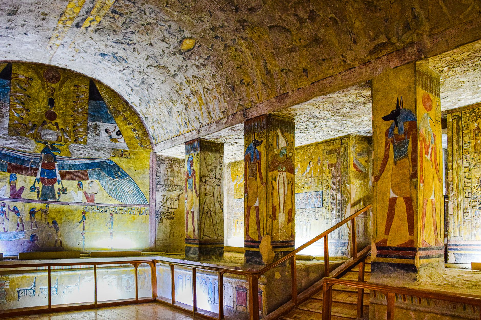 archaeologists brushing ancient painted menorah mural underground stone chamber